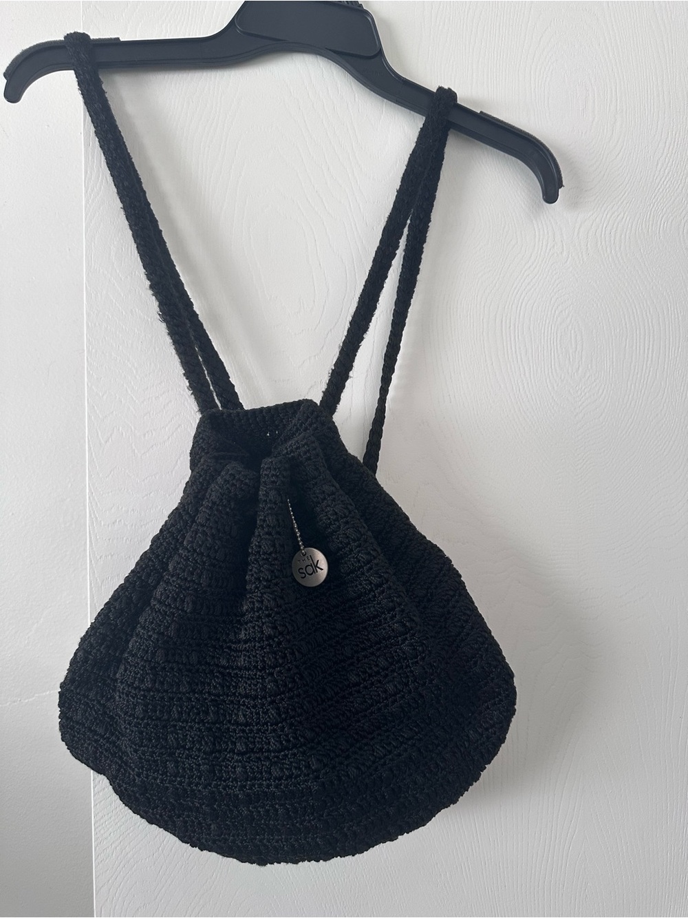 The Sak Black Crochet Drawstring Backpack Purse